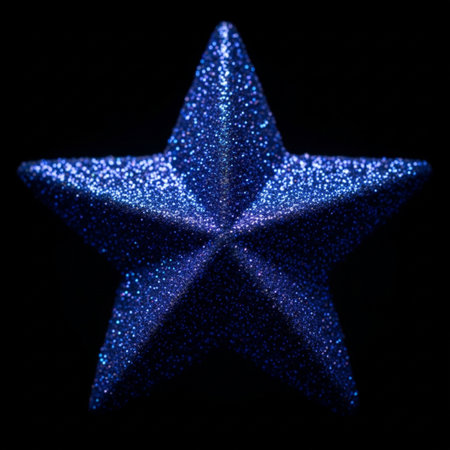 Blue star on a black background. Shallow depth of field.の素材