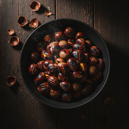 Roasted chestnuts in bowl on dark wooden background, top viewの素材