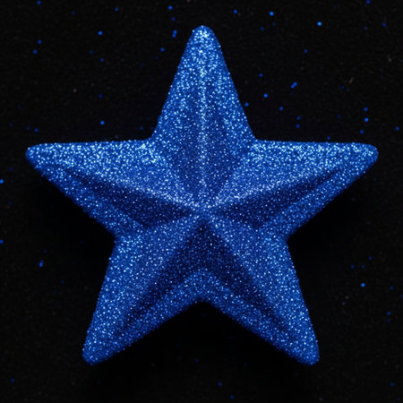 Blue star isolated on black background. Christmas and New Year concept.の素材