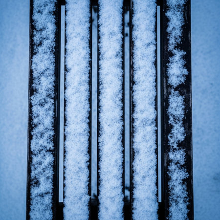 snow on the metal bench in blue tone. abstract background and texture.の素材
