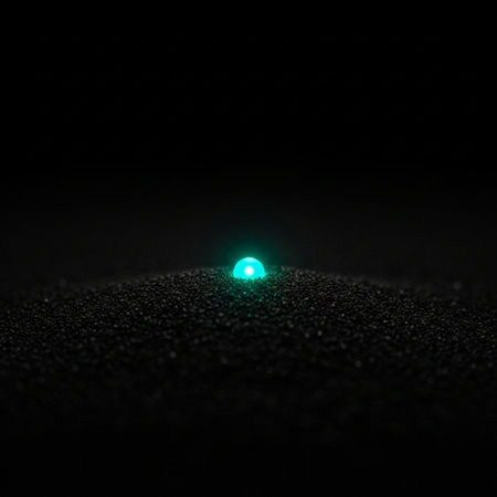 3D rendering of a blue and green light bulb on a black backgroundの素材