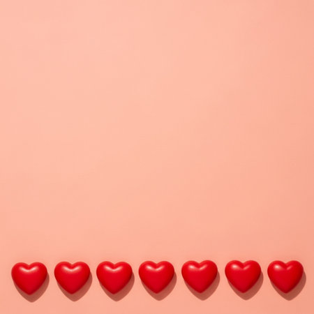 Valentines day background with red hearts on pastel pink backgroundの素材
