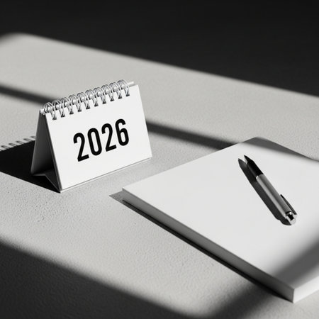 2026 New Year calendar on a table with notebook and pen.の素材