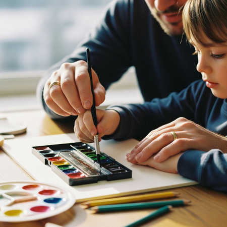 Father and son drawing with watercolors at home. Education concept.の素材