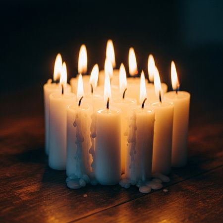 Burning candles on a wooden background. Shallow depth of field.の素材
