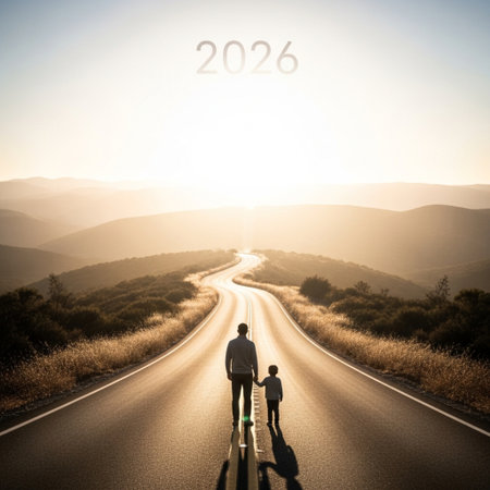 Silhouette of a father and son on the road at sunsetの素材