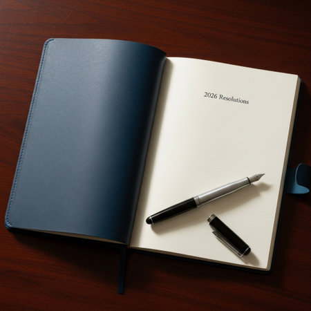 Notebook with pen on the wooden table. Top view with copy space.の素材