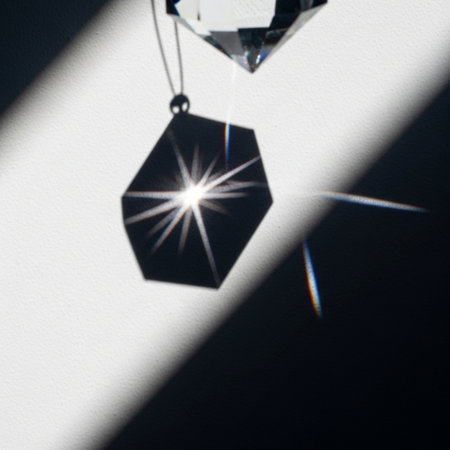 Diamonds on a white background with a shadow from the window.の素材