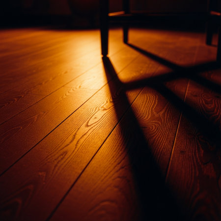 Wooden floor with a chair and a shadow from the chair.の素材