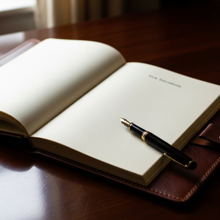 Notebook and fountain pen on a wooden table with shallow depth of fieldの素材