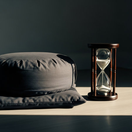 Hourglass and pillow on a wooden floor. Concept of time.の素材