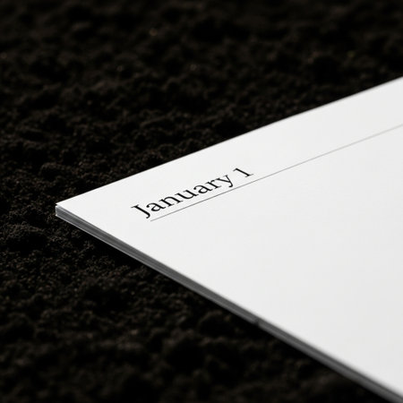 Closeup of a white business card on a black soil background.の素材