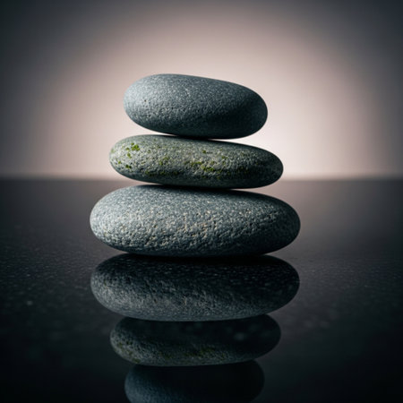 stack of zen stones on black background with reflection and space for textの素材