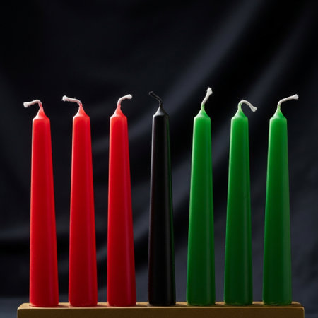 Red and green candles on a wooden stand against a dark background.の素材