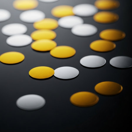 close up of yellow and white pills on black background with copy spaceの素材
