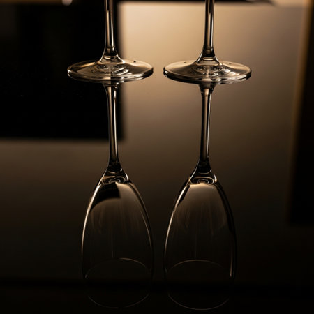 two wine glasses on a black background, close-up, reflectionの素材