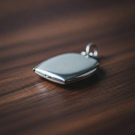 Silver keychain on a wooden background, close-up, selective focusの素材