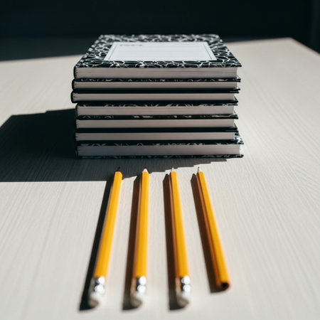 A stack of books and pencils on a white table. Back to school.の素材