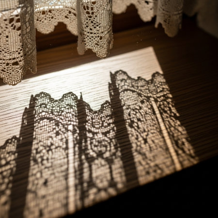 A pair of lace curtains on a window sill. Selective focus. Toned.の素材