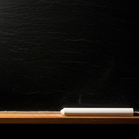 Blackboard and white chalk on a black background. Copy space.の素材