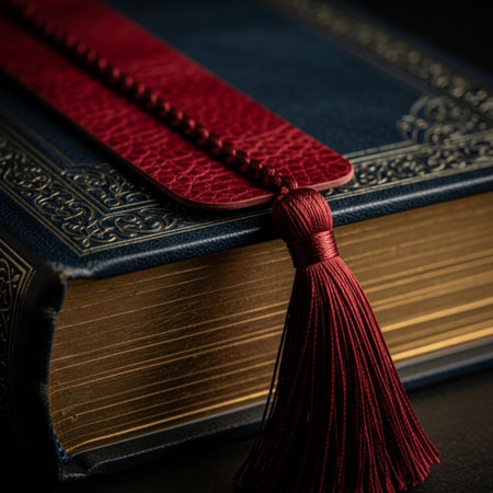 Book with red bookmark on a black background. Close-up.の素材