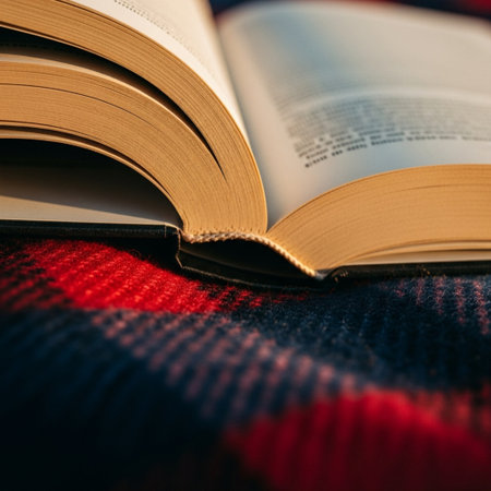 Open book on a plaid background. Selective focus. Toned.の素材