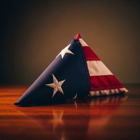 Flag of the United States of America on a wooden table against a dark backgroundの素材