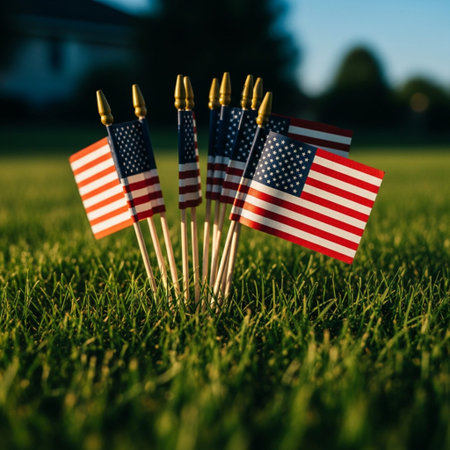 American flags on green grass. Independence Day concept. Selective focus.の素材