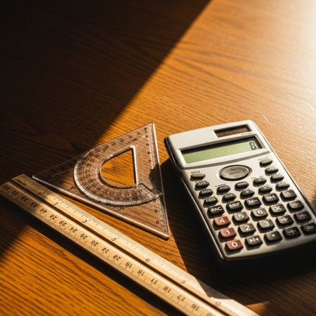 calculator and ruler on the table in the light of the morning sunの素材