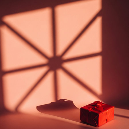 Red gift box with shadow on pink wall. Minimal concept.の素材