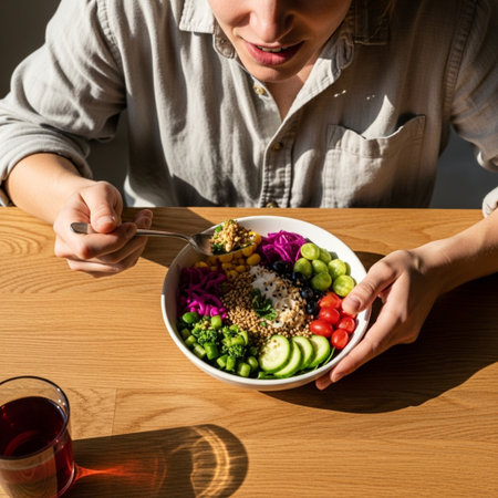 A cheerful person enjoying a high-angle view of a vibrant power bowl lunch captured in harsh sunlighの素材