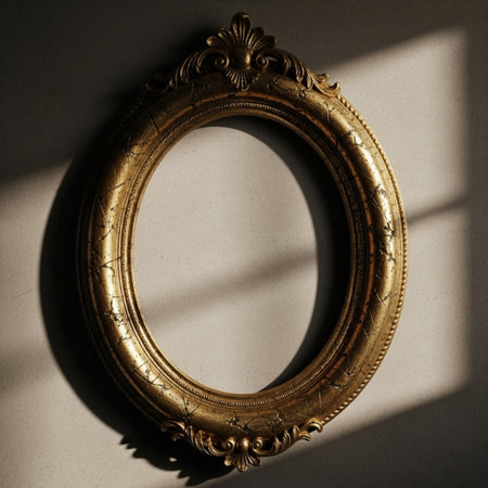 An antique, empty oval portrait frame, highly ornate and featuring distressed gold gilding, capturedの素材
