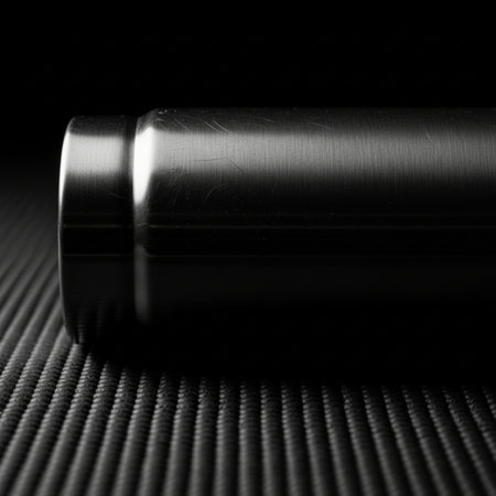 Editorial quality, low-key side profile silhouette of a minimalist stainless steel water bottle sittの素材