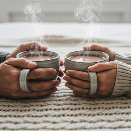 A Hero Detail shot focusing strictly on the centered composition of two hands warming themselves aroの素材