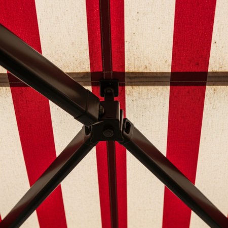 Square format (1:1), extremely tight close-up detail of vintage red and white striped awning fabric.の素材