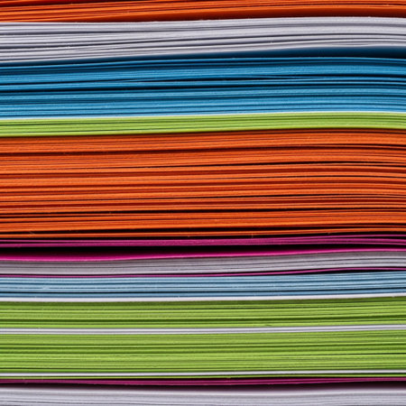 An extreme close-up, abstract photograph of the layered edge of a massive, tightly compressed stackの素材