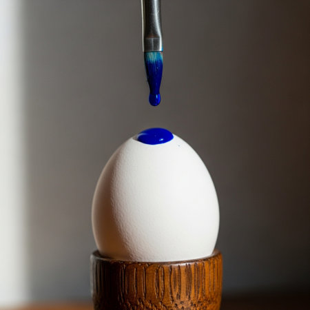 A hero detail close-up in a square composition showing the precise moment a single drop of rich royaの素材