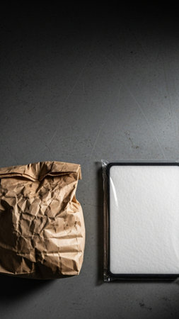 A tall, vertical 9:16 composition showcasing the juxtaposition of a heavily used, greasy brown paperの素材