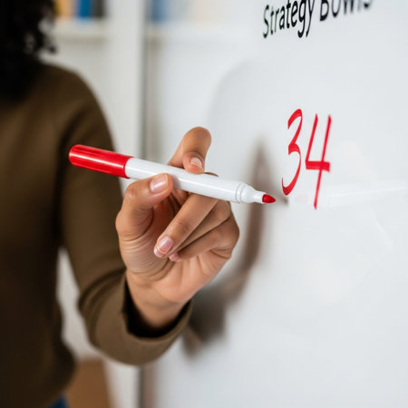 Square close-up (1:1) focusing on a young woman's hand holding a red dry-erase marker, the tip restiの素材