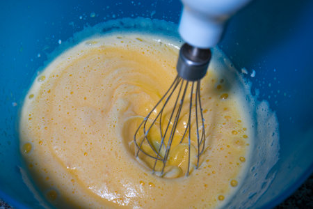 Whipping egg to make meringue.の写真素材