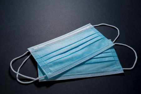 Face masks for virus protection on black backgroundの写真素材