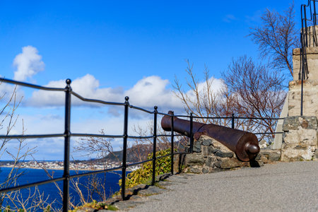 AALESUND, NORWAY - 2017 APRIL 27. Ancient cannon located at the walking path to Fjellstuen at Aalesund.のeditorial素材