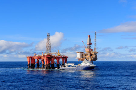 NORTH SEA, UK - 2016 OCTOBER 01. AHTS vessel Island Valiant doing rig move operation for semi...