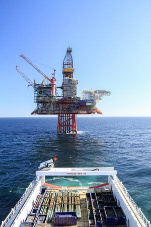 NORTH SEA, NORWAY - 2011 APRIL 27. Offshore AHTS vessel with cargo to the oil platform Ringhorn in the North Seaのeditorial素材
