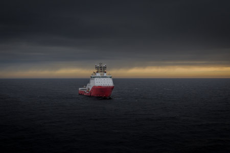 Anchor handling Vessel Siem Topaz with the sunset in the background. Taken in Kara Sea Russia September 2014のeditorial素材