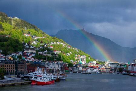 BERGEN NORWAY - 2015 JUNE 01. Bergen city with dark clouds and rainbow.の写真素材