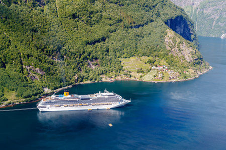 GEIRANGER, NORWAY - 2016 JUNE 13. Cruise vessel Costa Favolosa in the Norwegian fjord in Geirangerのeditorial素材