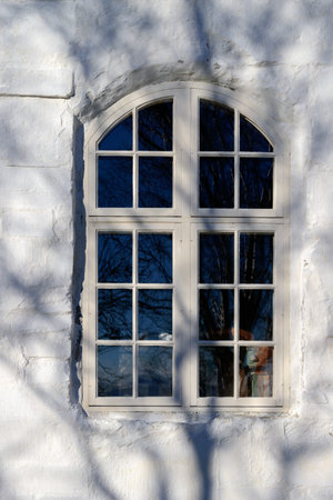 GISKE, NORWAY - 2017 MARCH 05. Old white building with beautiful window.