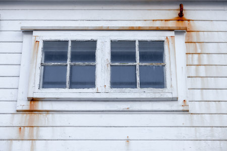 KRAAKENES LIGHTHOUSE, NORWAY - 2015 NOVEMBER 15. With all the low season weather with heavy wind and salty water make every thing to corrosive and will rust anything of iron or steel.のeditorial素材
