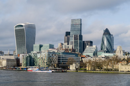 LONDON, ENGLAND - 2016 JANUARY 24. Skyline of The City in London with river Thames in the front.